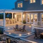 Three-level deck with white railings and LED post lights